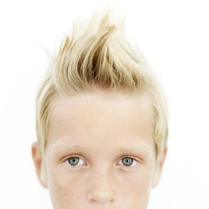 Young Boy (8-10) with His Hair Sticking Up